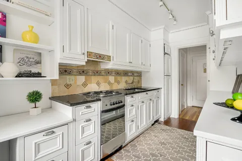 a large bedroom with a bed and window