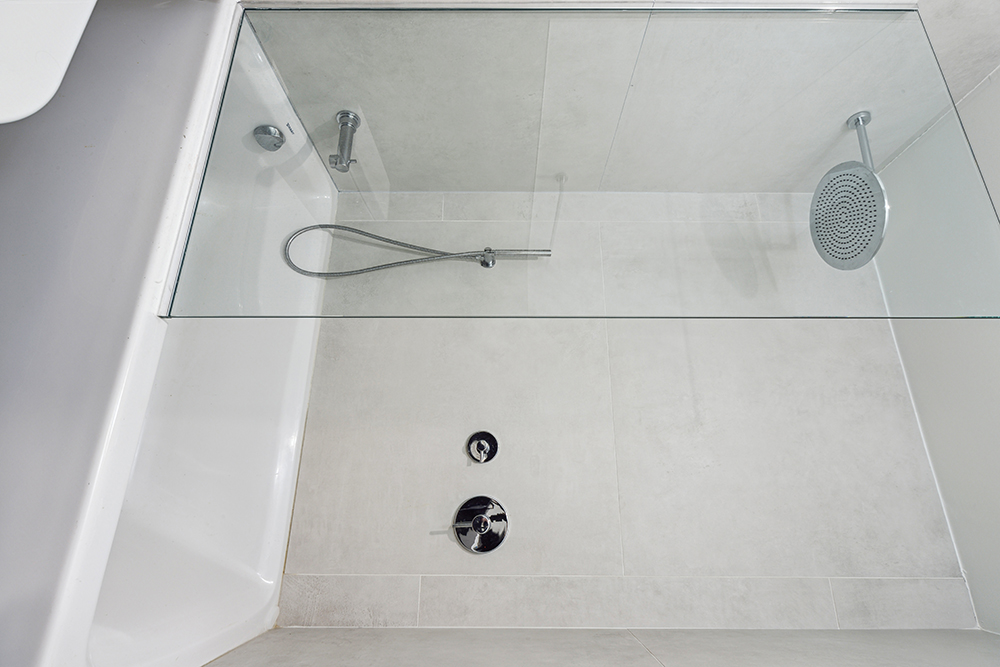 143 Winthrop Street, Unit 3C Brooklyn, NY 11225 - Photo 6 of 9 a bathroom with a bath tub with a shower