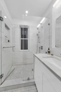 a bathroom with a sink and mirror