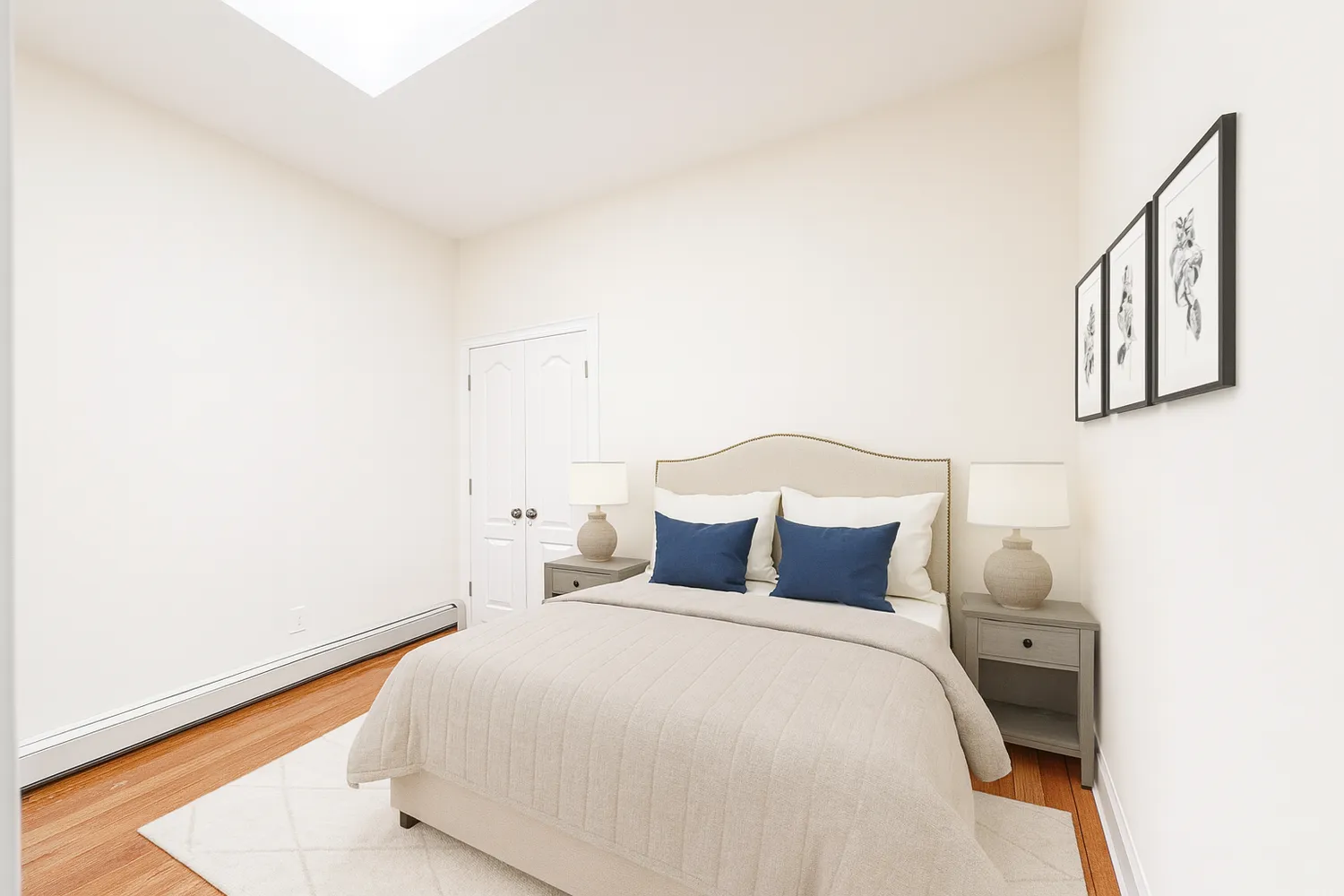 a bedroom with a bed and a night stand