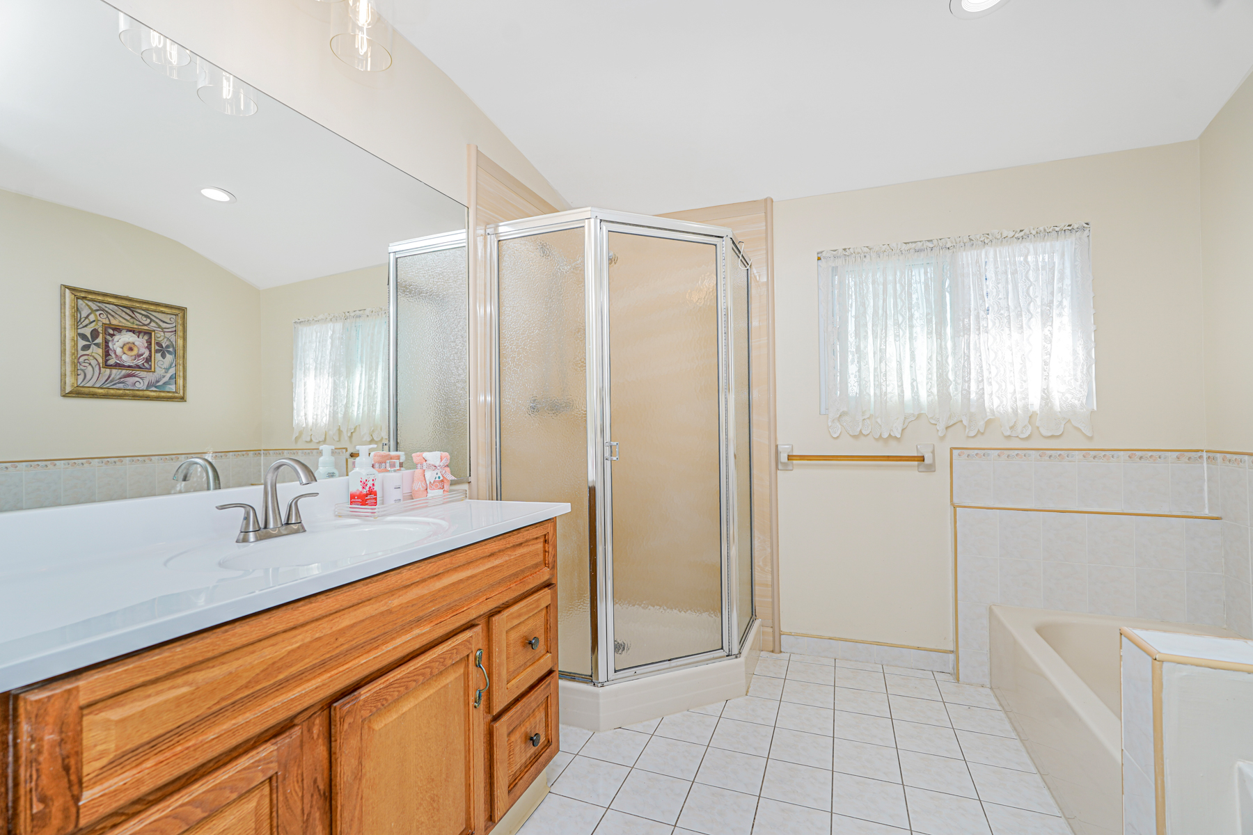287 Greaves Avenue Staten Island, NY 10308 - Photo 18 of 35 a bathroom with a sink and a mirror