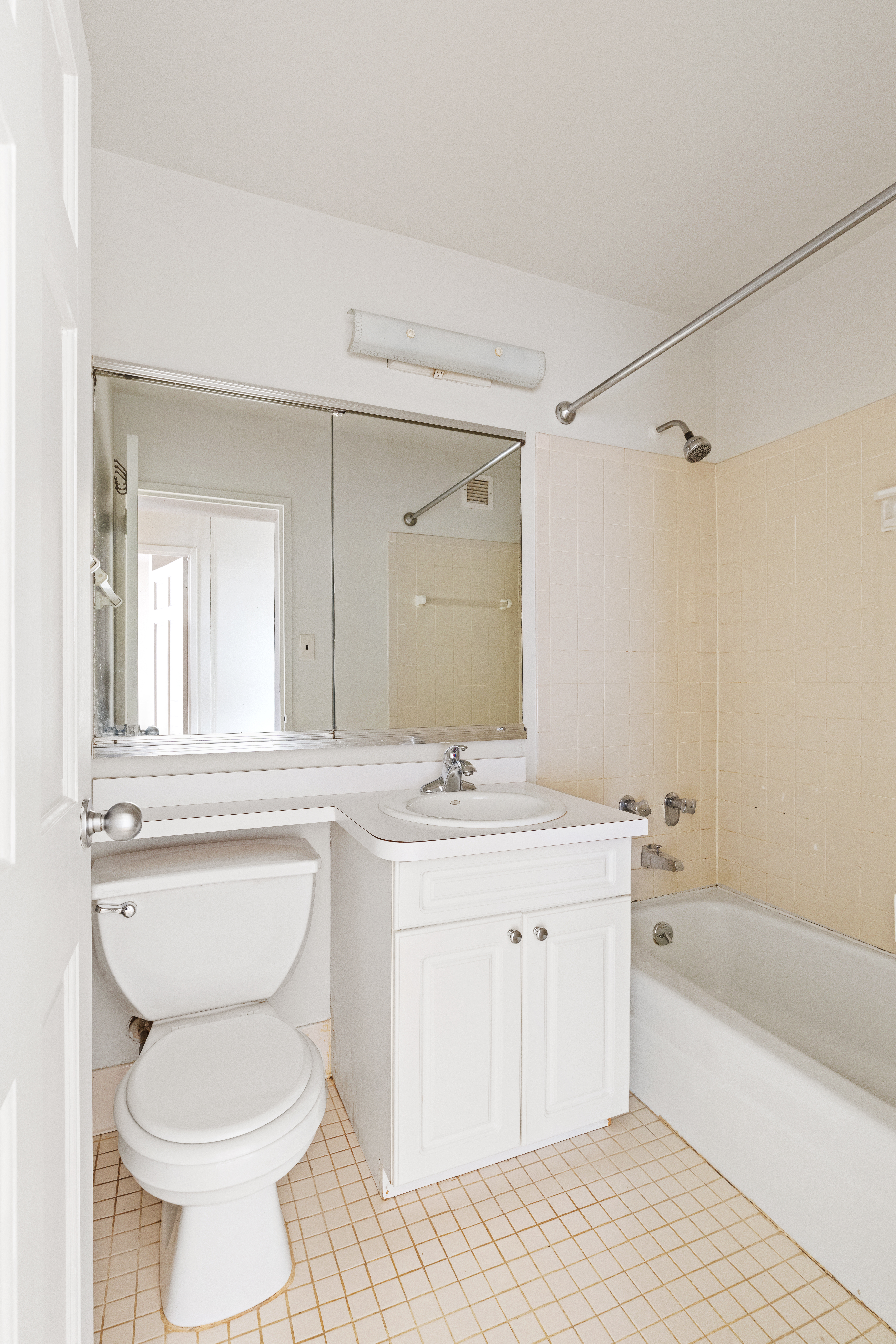 119 Morton Street, Unit 3A Manhattan, NY 10014 - Photo 6 of 7 a bathroom with a granite countertop toilet a sink and a bathtub