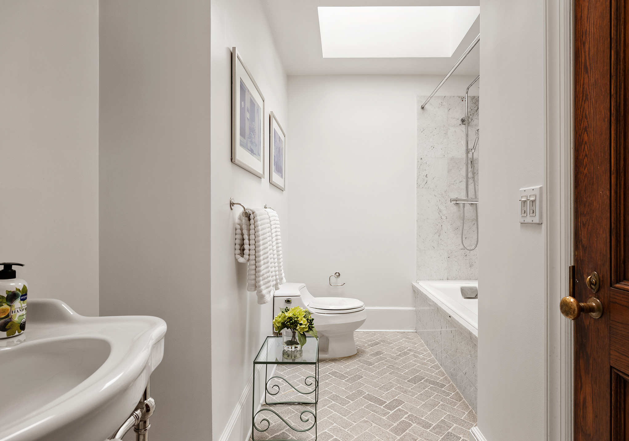 129 East 81st Street Manhattan, NY 10028 - Photo 14 of 17 a bathroom with a sink toilet and shower