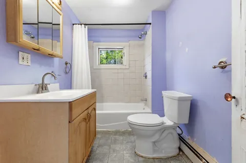a kitchen with a stove a sink and a microwave