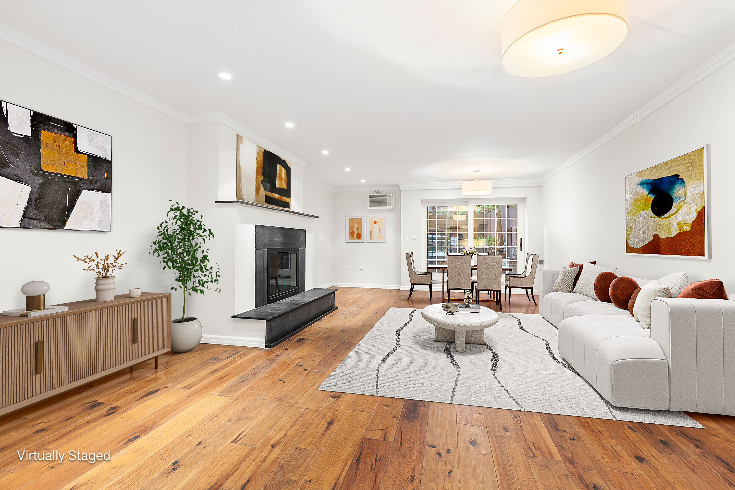 522 East 82nd Street, Unit 1 Manhattan, NY 10028 - Photo 4 of 16 a living room with furniture fireplace and flat screen tv