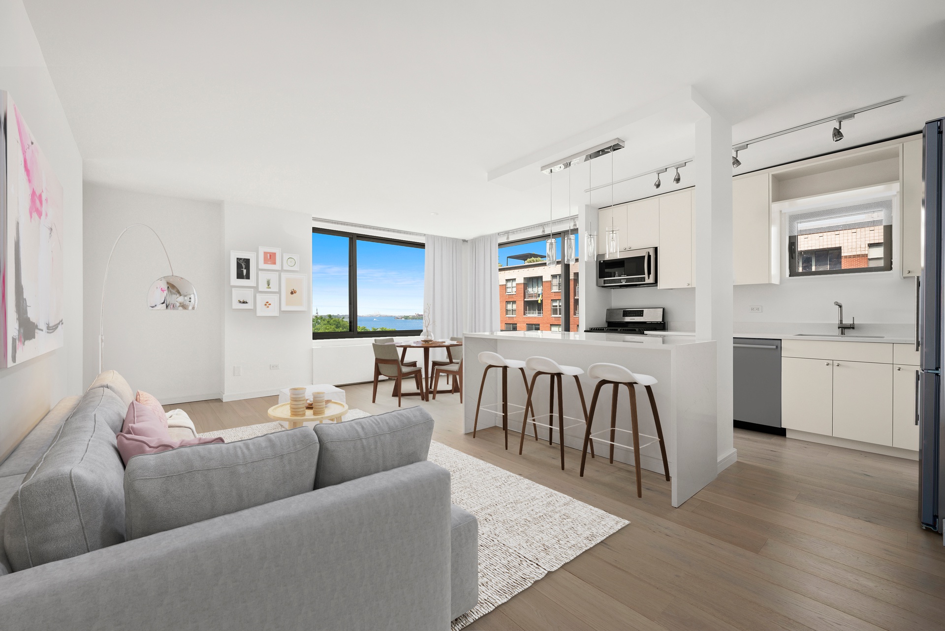 2 South End Avenue, Unit 8C Manhattan, NY 10280 - Photo 2 of 6 a living room with furniture and a flat screen tv