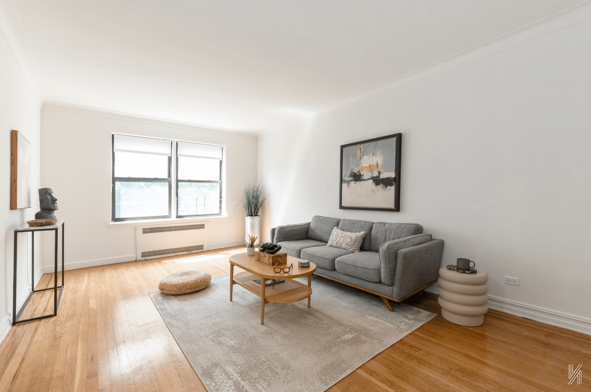 35-35 75th Street, Unit 428 Queens, NY 11372 - Photo 3 of 21 a living room with furniture and a window