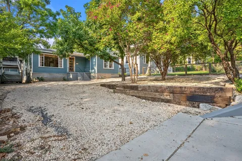 a house with trees in the background