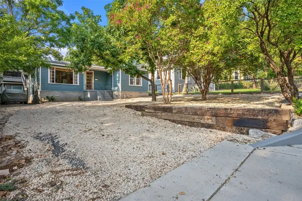 a house with trees in the background
