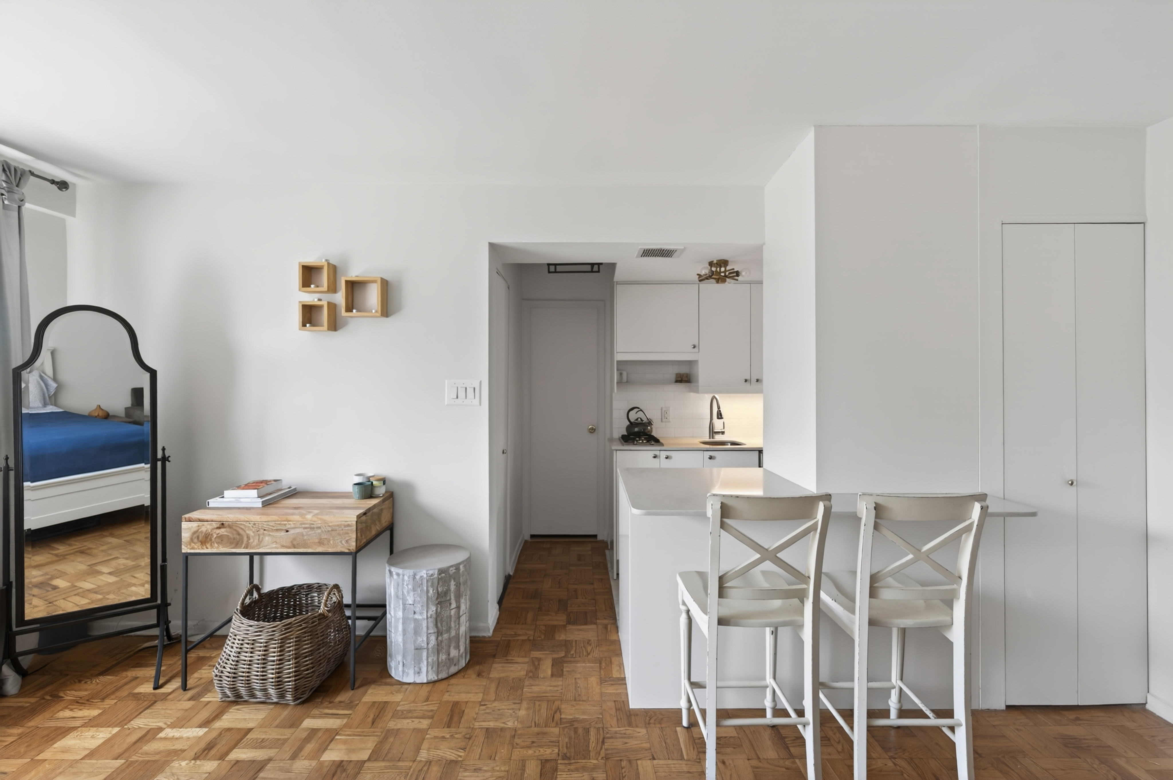 233 East 69th Street, Unit 16F Manhattan, NY 10021 - Photo 3 of 11 a dining room with furniture and wooden floor