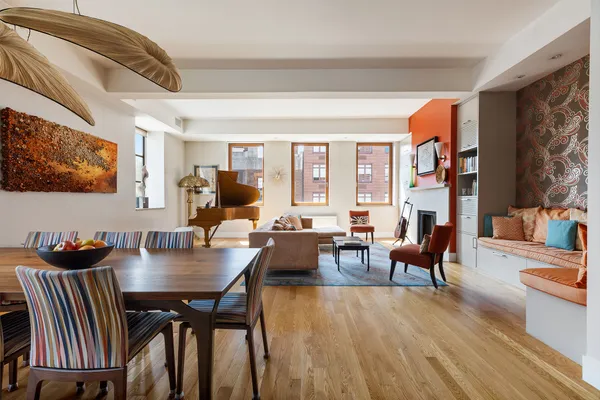 a dining room with furniture and wooden floor