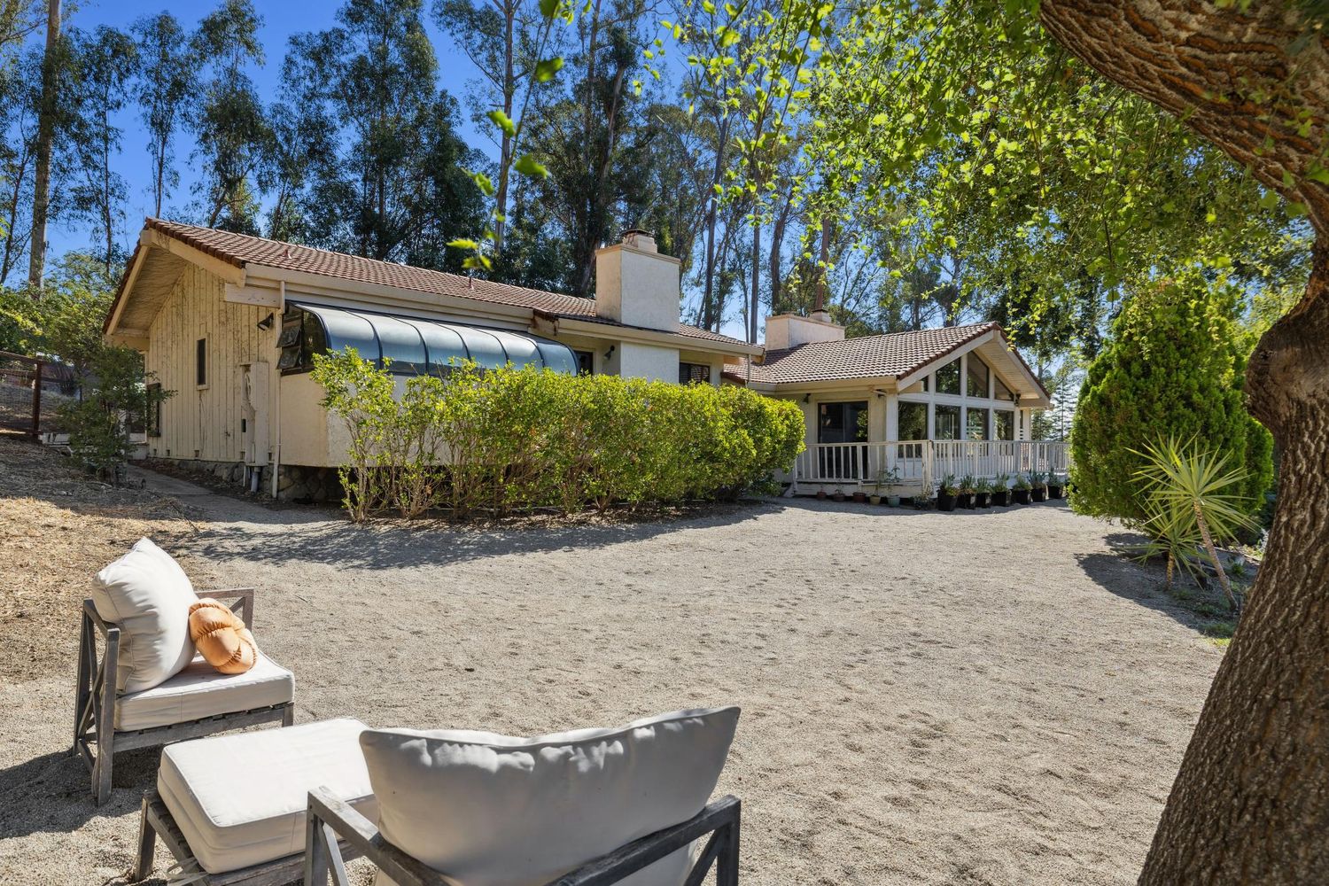 a front view of a house with garden