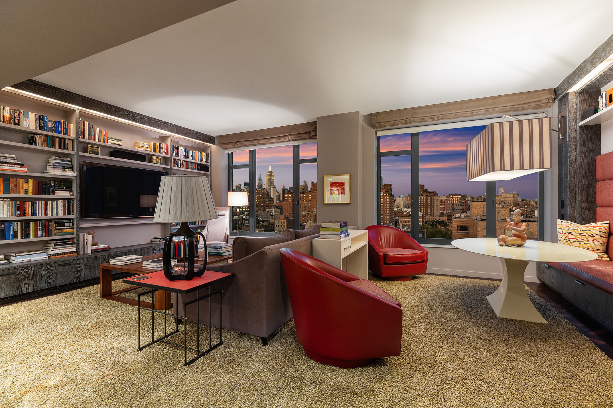 400 West 12th Street, Unit 12C Manhattan, NY 10014 - Photo 15 of 24 a living room with furniture and a flat screen tv