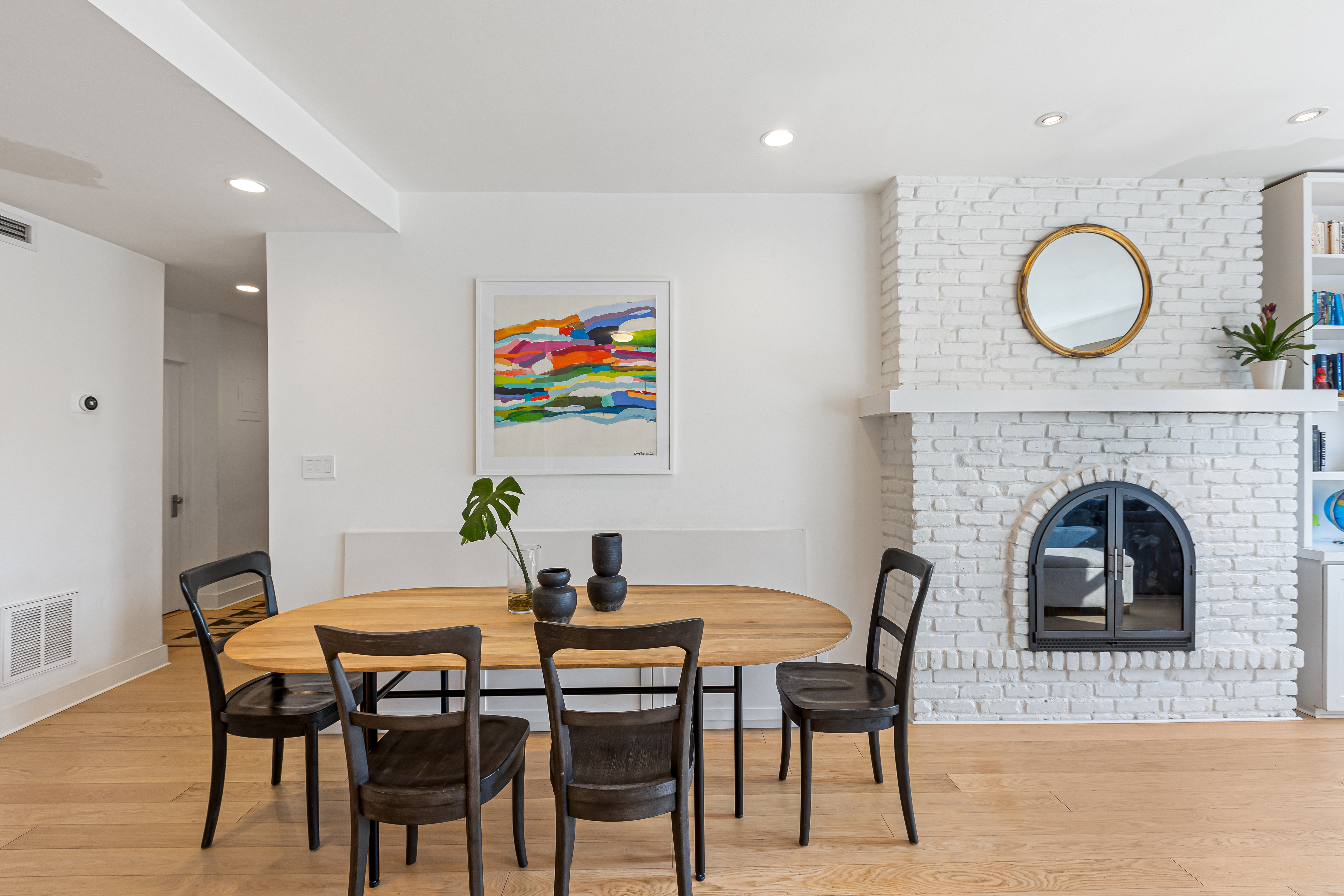 277 Hicks Street, Unit 4D Brooklyn, NY 11201 - Photo 6 of 15 a view of a dining room with furniture and a fireplace