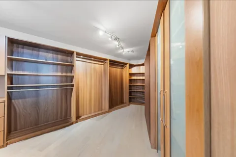 a view of an empty room with a staircase