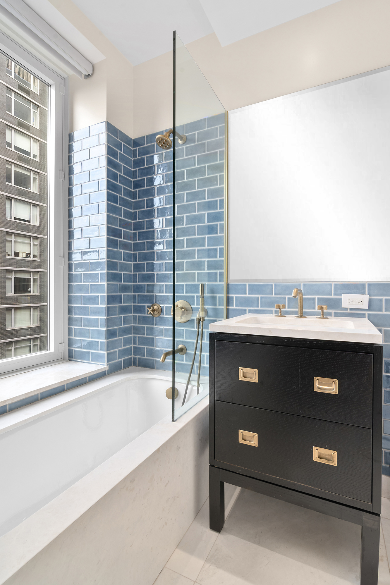 93 Worth Street, Unit 1006 Manhattan, NY 10013 - Photo 13 of 18 a bathroom with a sink and a bathtub