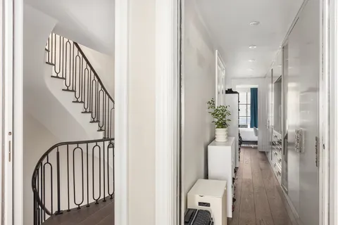 a bedroom with a bed and glass window