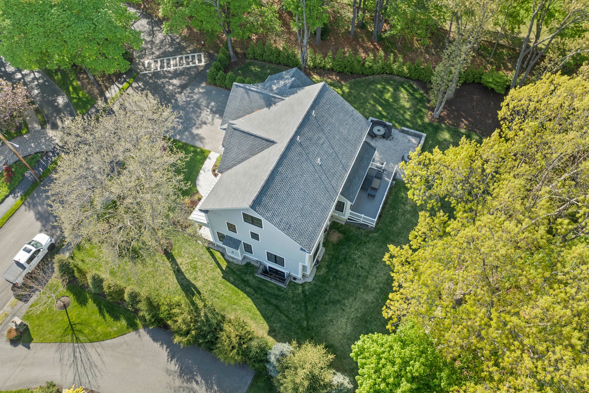 241 Lowell Road Wellesley, MA 02481 - Photo 76 of 85 an aerial view of a house with a yard and garden