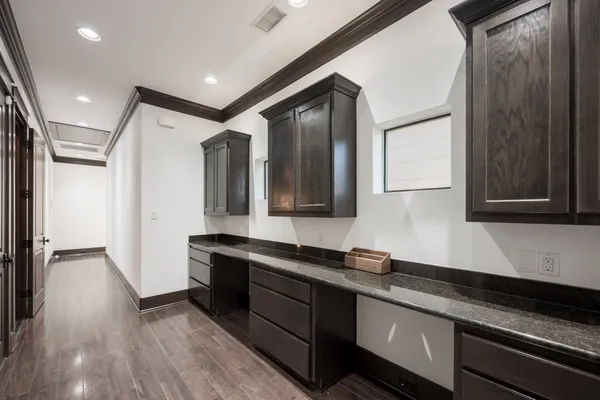 a view of a chair and table in backyard of the house