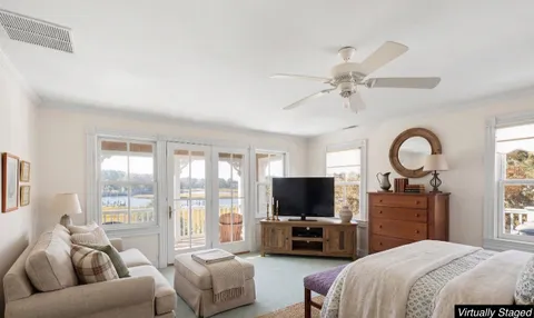 an aerial view of a house with swimming pool and porch