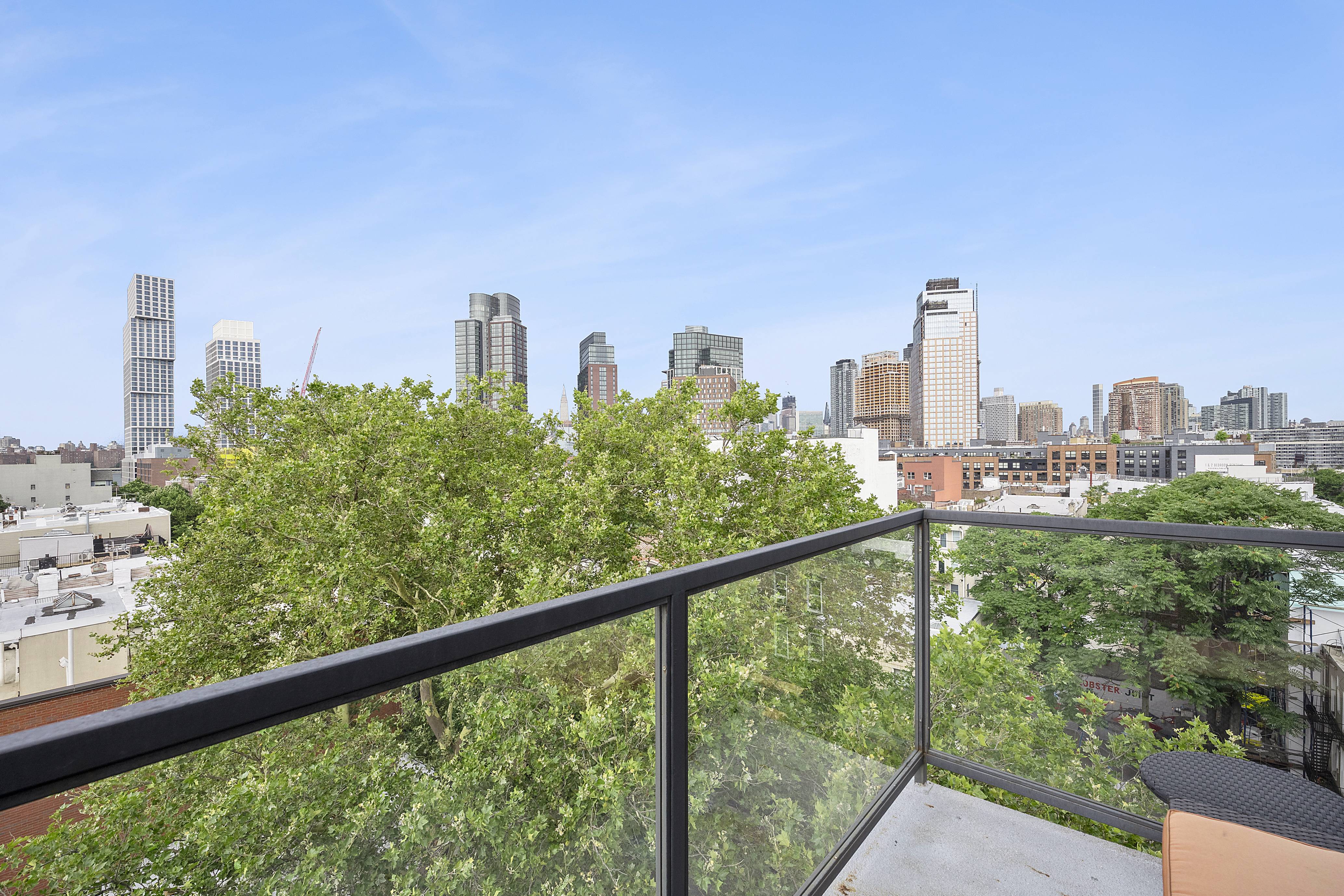 1059 Manhattan Avenue, Unit PHB Brooklyn, NY 11222 - Photo 6 of 8 a view of a city from a balcony