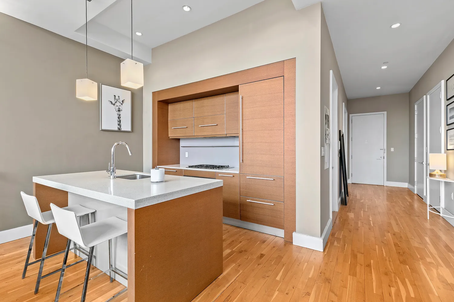a view of a dining room with furniture a chandelier and wooden floor