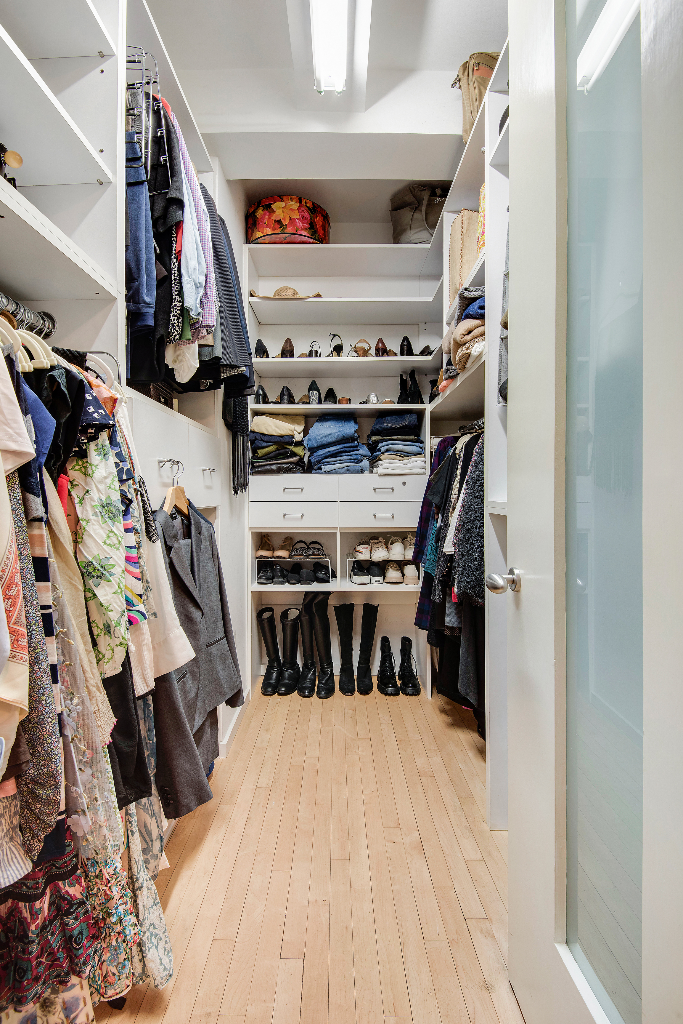 434 East 52nd Street, Unit 1BH Manhattan, NY 10022 - Photo 8 of 23 a view of walk in closet with clothes and shoes