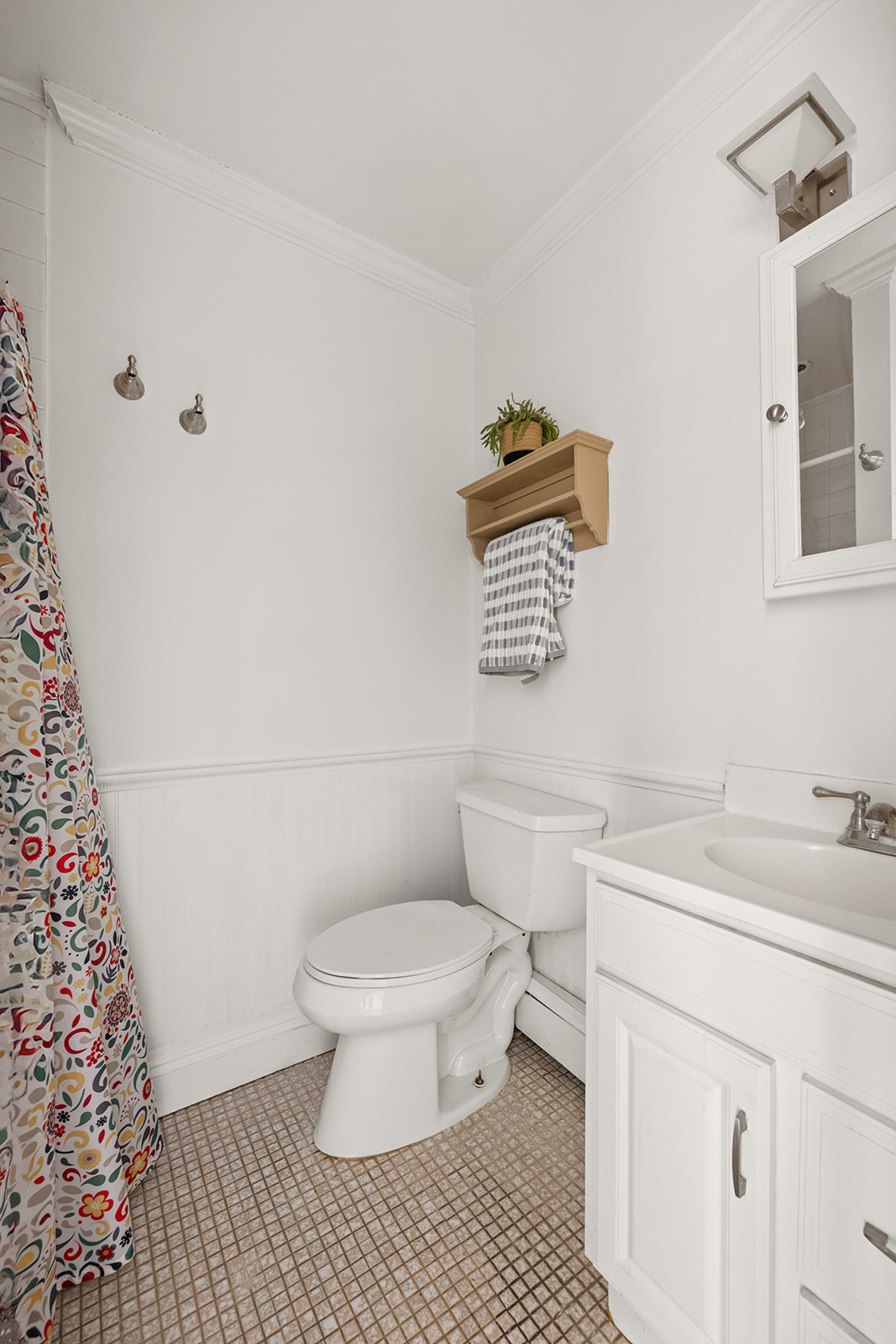 491 12th Street, Unit 2 Brooklyn, NY 11215 - Photo 10 of 21 a bathroom with a sink toilet and a mirror
