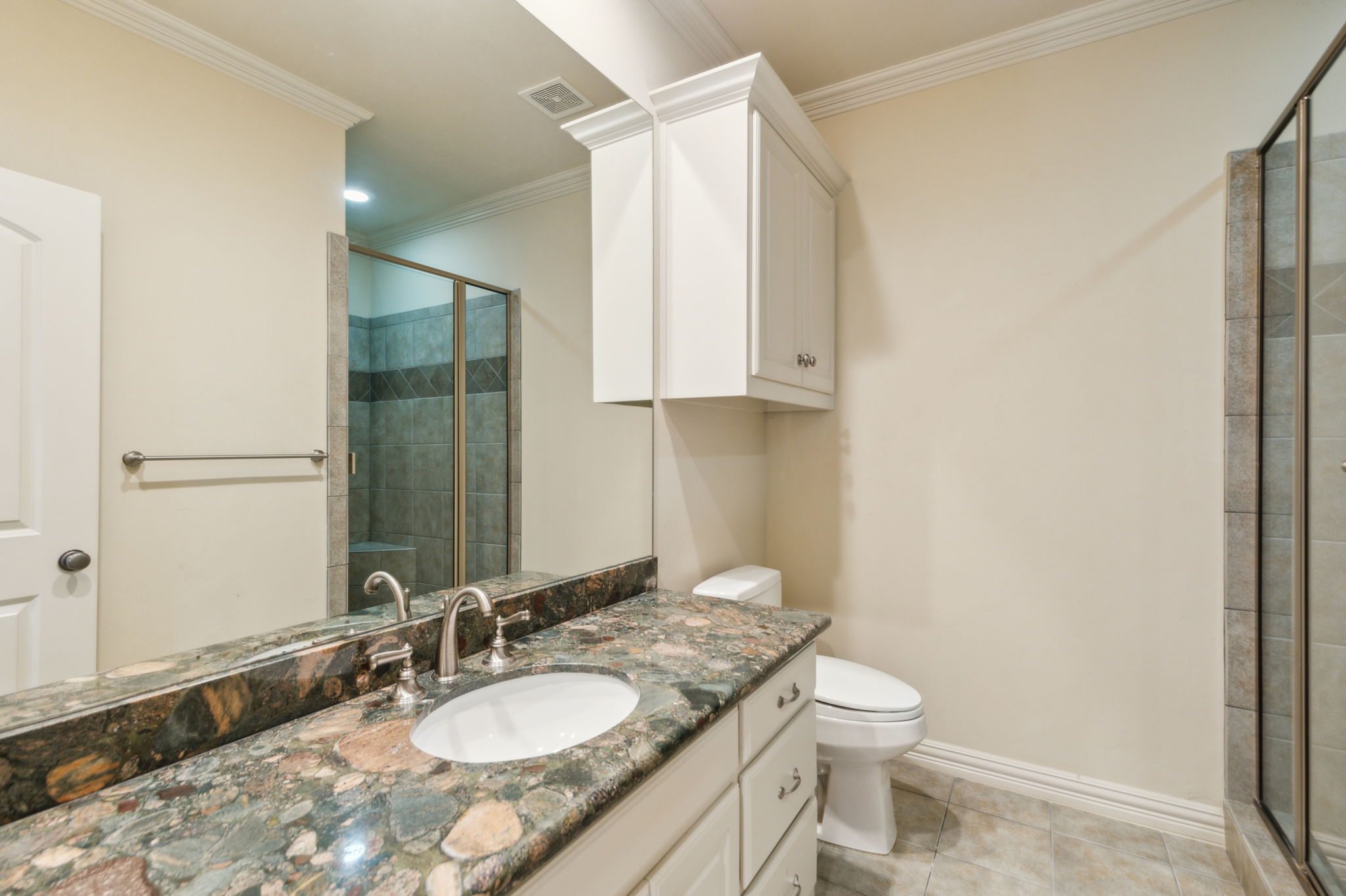 11503 West Ricks Circle Dallas, TX 75230 - Photo 26 of 39 a bathroom with a granite countertop sink toilet and a mirror