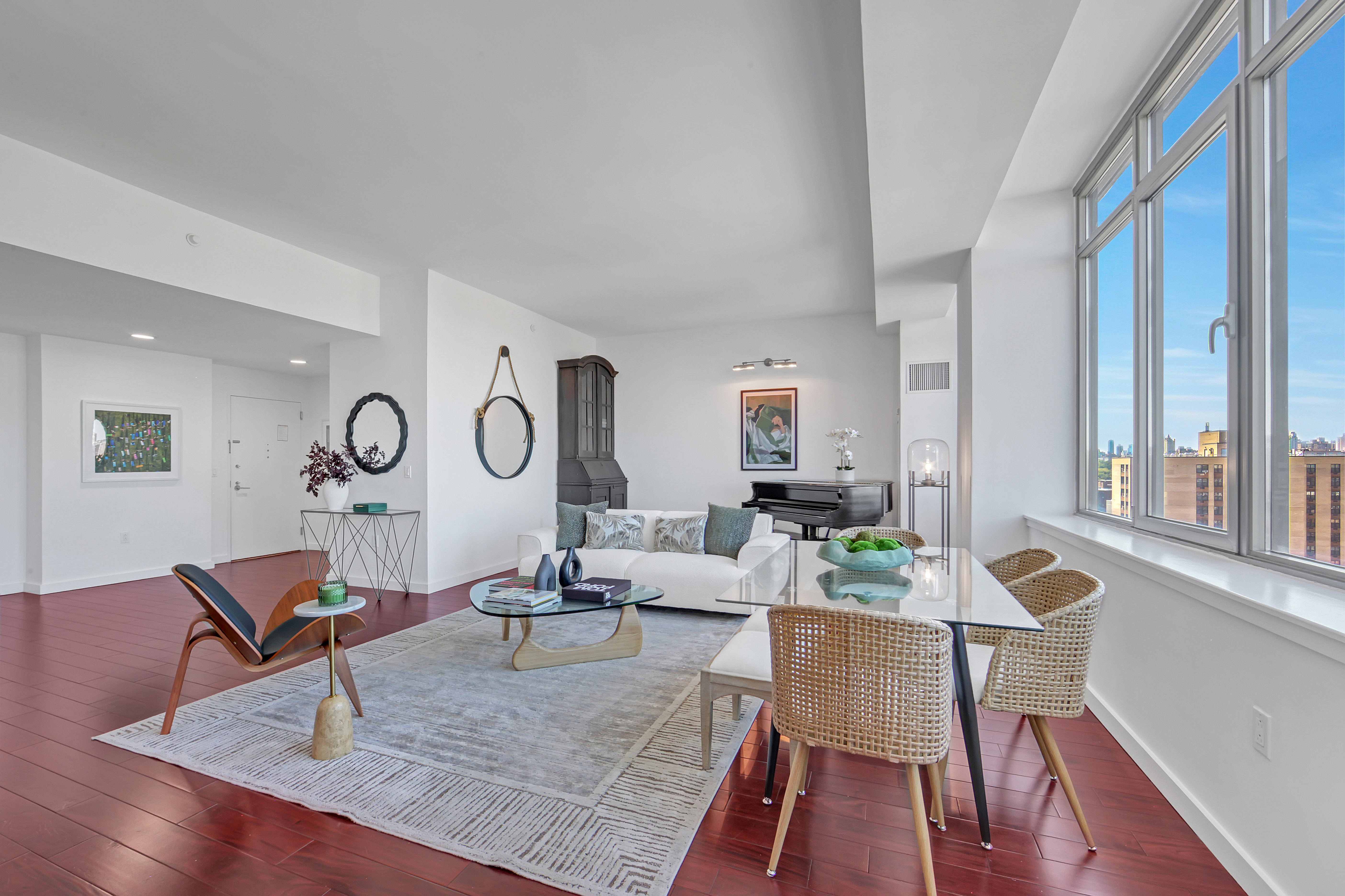1485 5th Avenue, Unit 18/19H Manhattan, NY 10035 - Photo 4 of 24 a living room with furniture a table and wooden floor