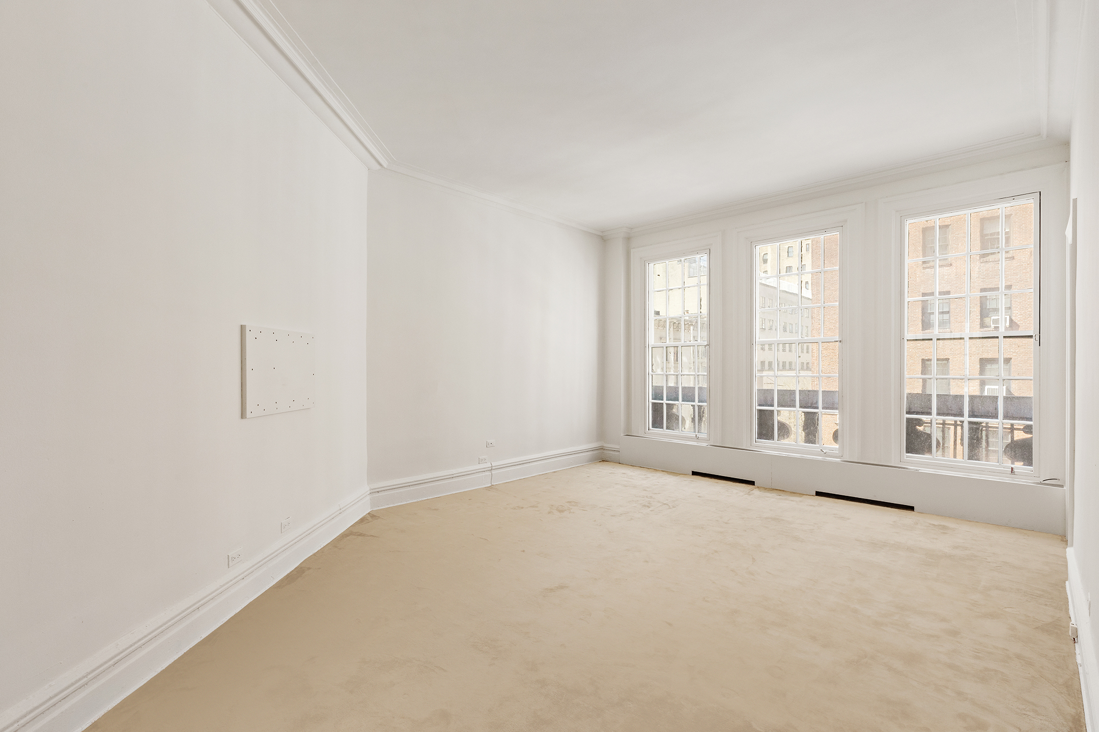 45 East 66th Street, Unit 4NW Manhattan, NY 10065 - Photo 15 of 29 an empty room with windows