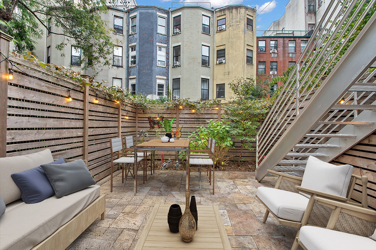 208 West 122nd Street Manhattan, NY 10027 - Photo 15 of 22 a view of a patio with couches table and chairs and potted plants