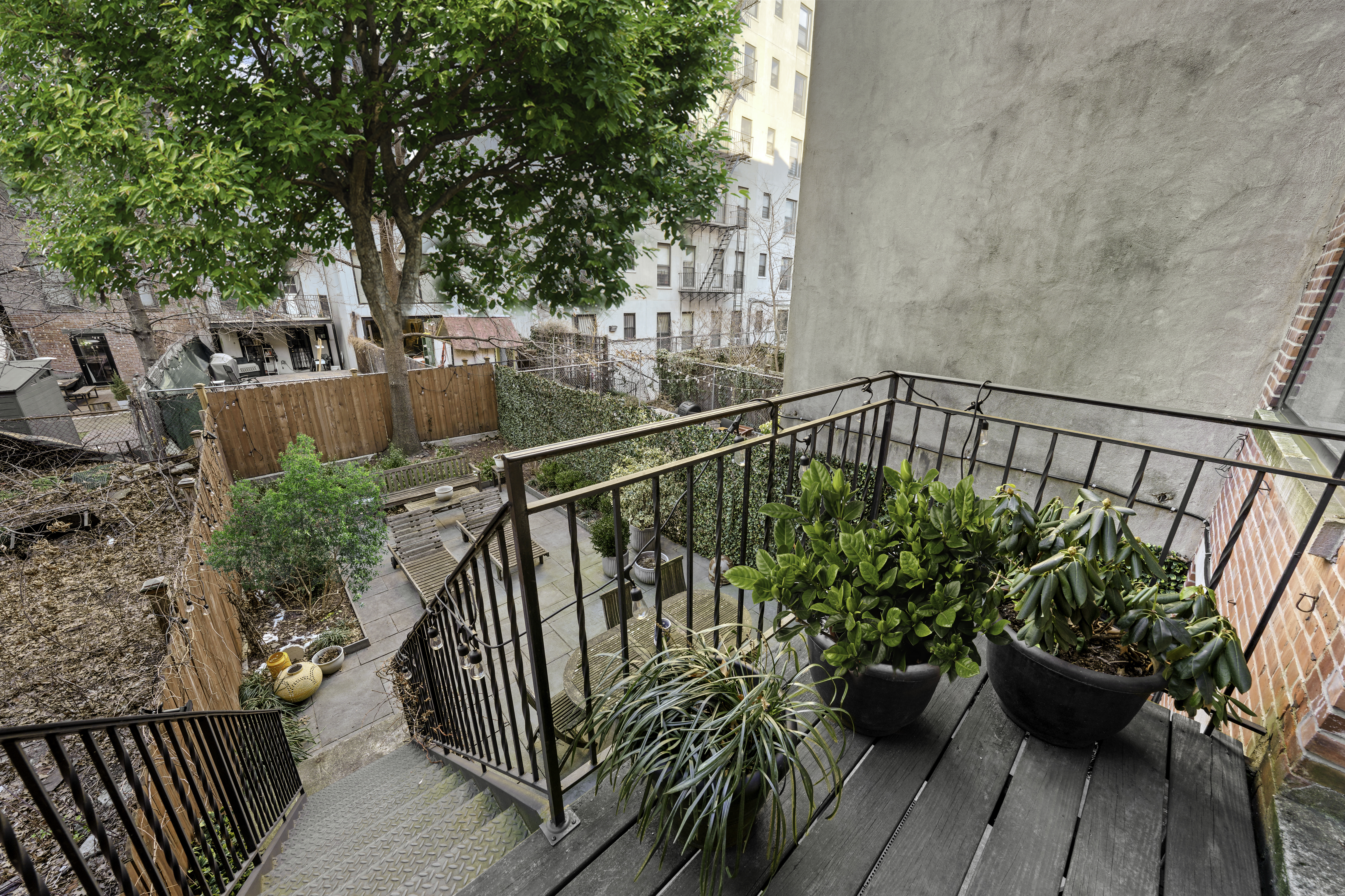127 West 122nd Street Manhattan, NY 10027 - Photo 14 of 17 a view of balcony with seating and trees