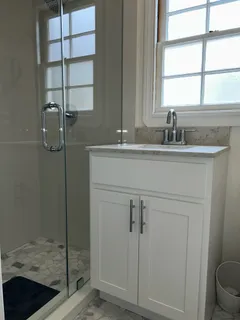 a bathroom with a sink and a mirror