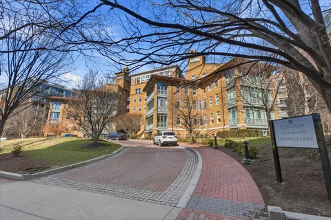 a room with pool table and a ceiling fan