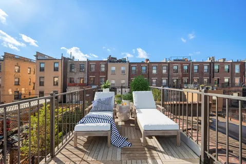 a view of a balcony with wooden floor