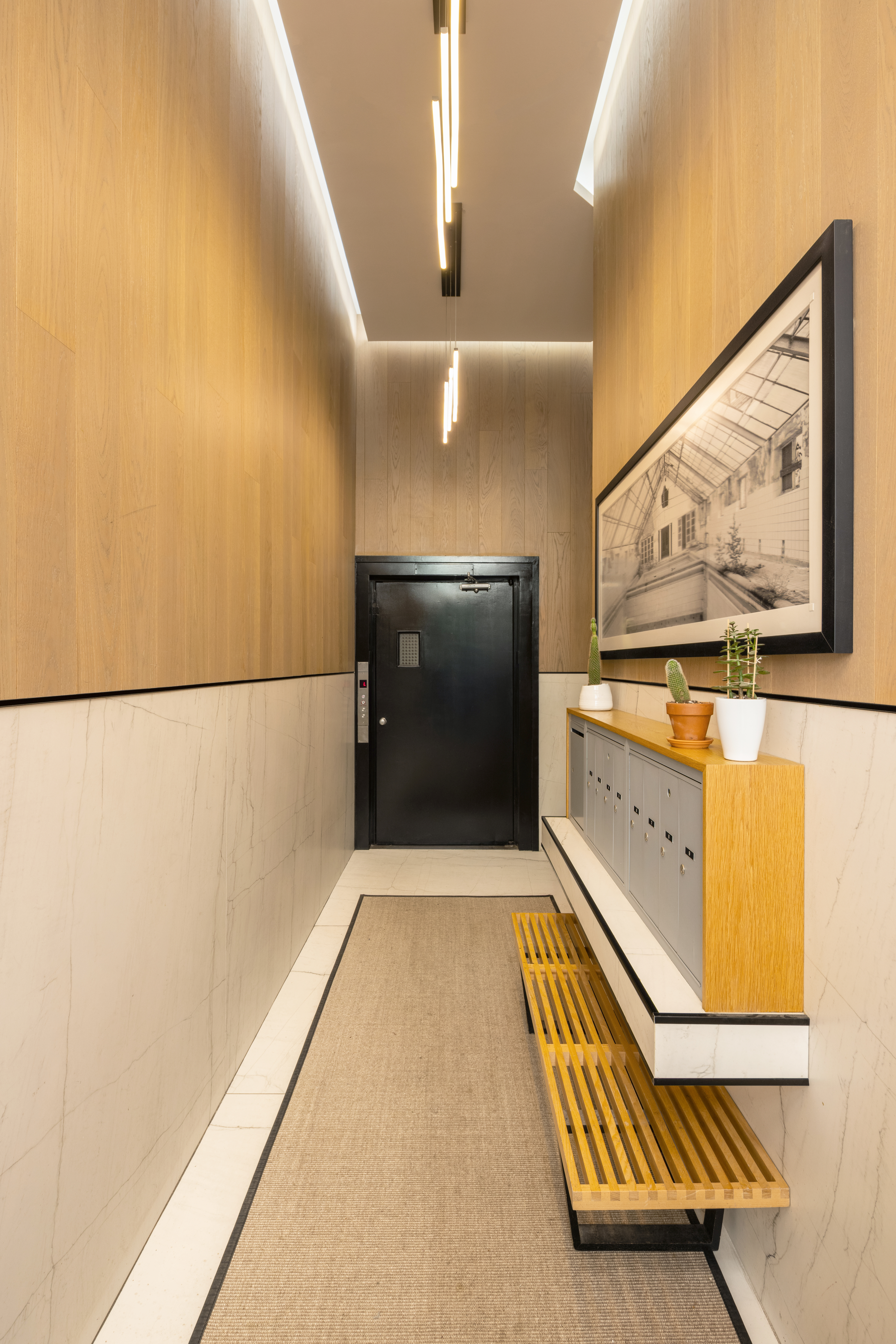 56 East 11th Street, Unit 5 Manhattan, NY 10003 - Photo 13 of 18 a hallway with wooden floor