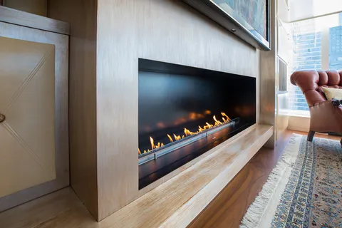 a living room with furniture flat screen tv and a fireplace