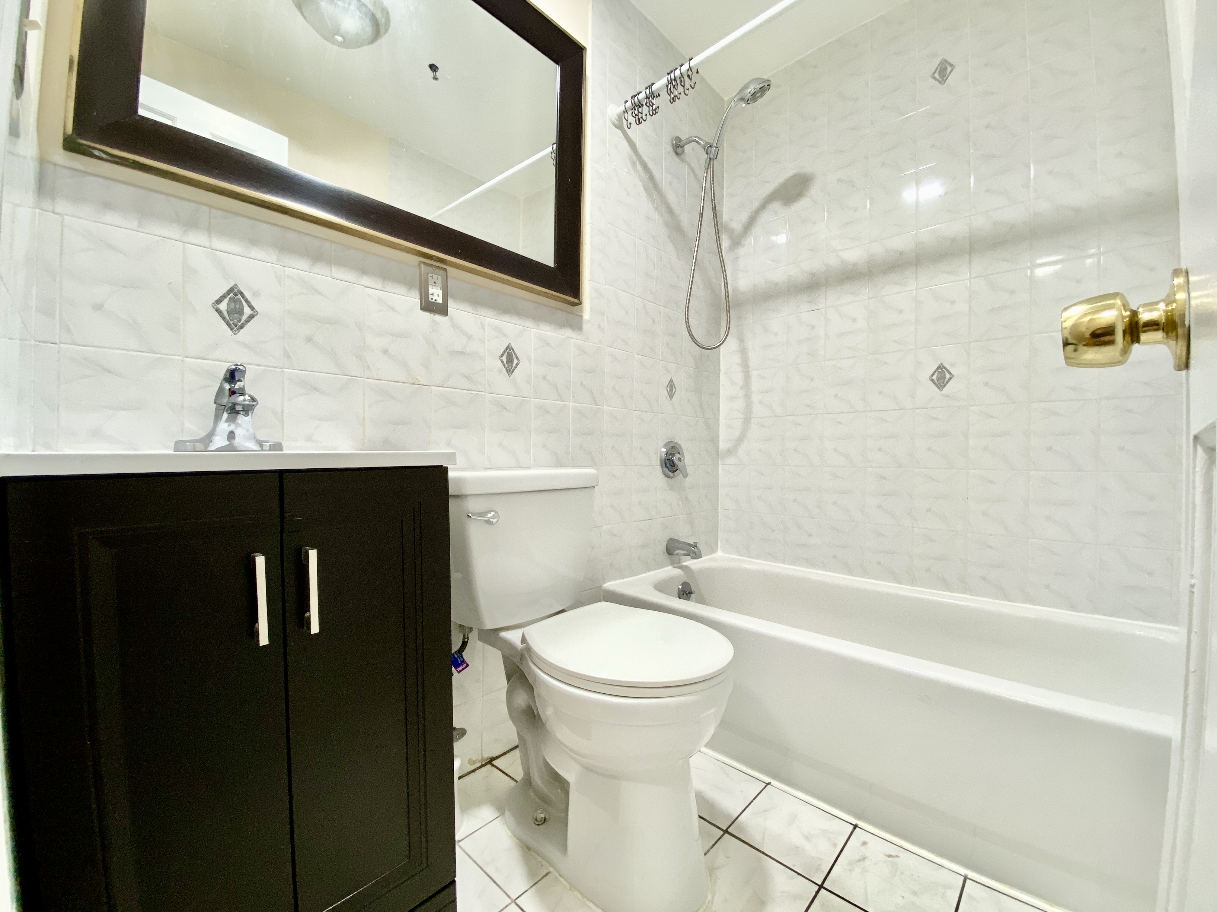 373 Gates Avenue, Unit 4 Brooklyn, NY 11216 - Photo 10 of 10 a bathroom with a sink a toilet and shower