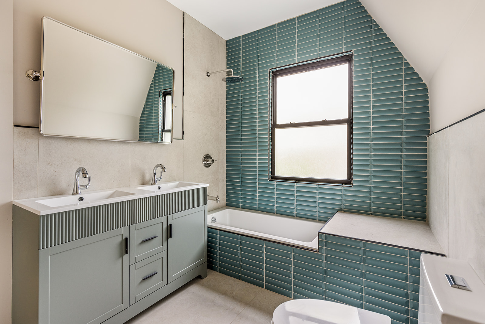 697 East 21st Street Brooklyn, NY 11210 - Photo 12 of 18 a bathroom with a sink mirror and a bathtub