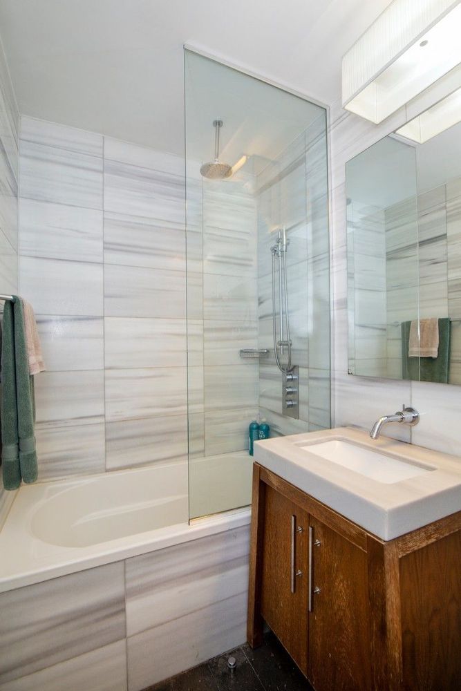 88 Greenwich Street, Unit 1218 Manhattan, NY 10006 - Photo 9 of 30 a bathroom with a sink and a bathtub