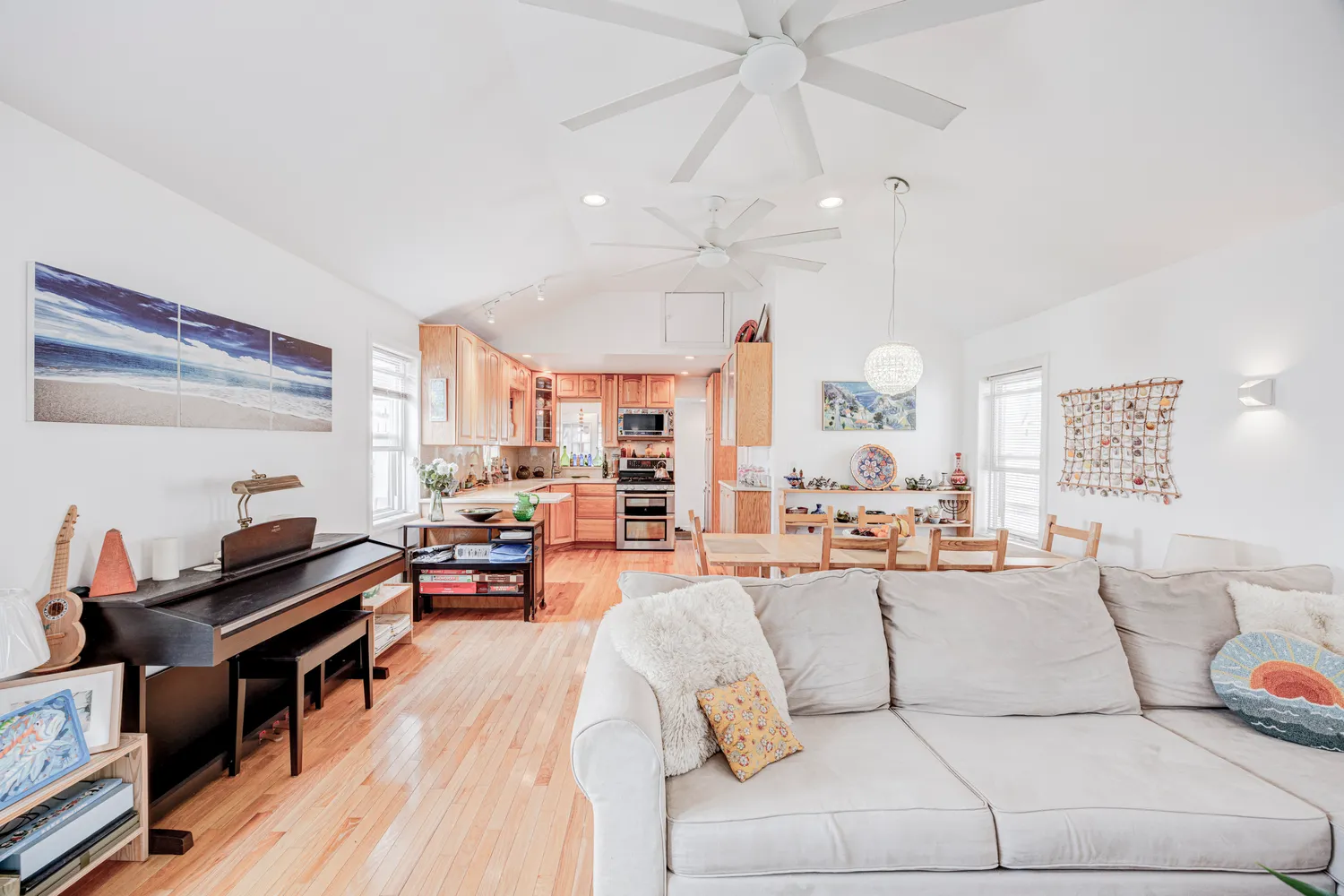 a living room with furniture and wooden floor