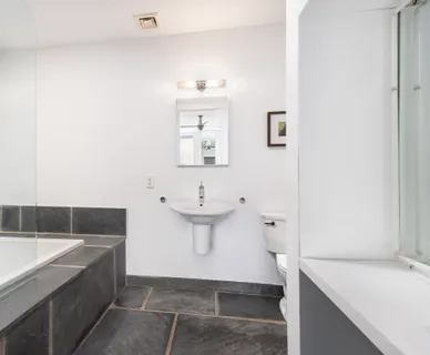 a bathroom with a sink and a bathtub