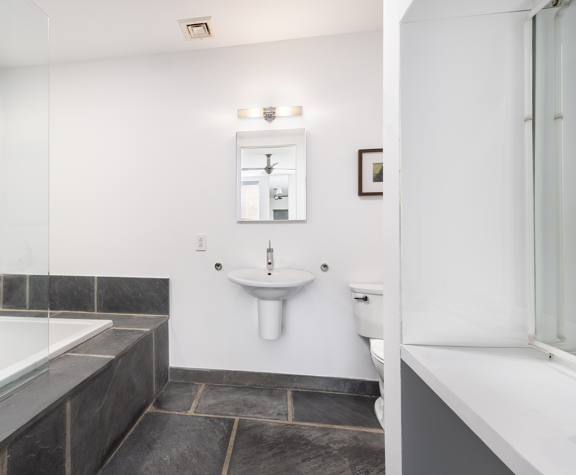 25 Leonard Street, Unit 2 New York, NY 10013 - Photo 6 of 12 a bathroom with a sink and a bathtub