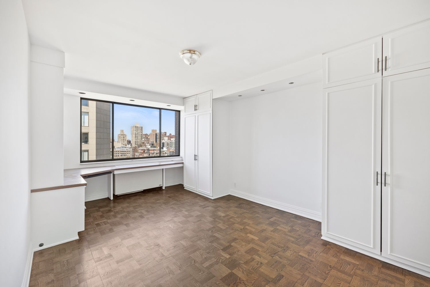 40 East 80th Street, Unit 25A Manhattan, NY 10075 - Photo 13 of 18 a view of workspace with flat screen tv