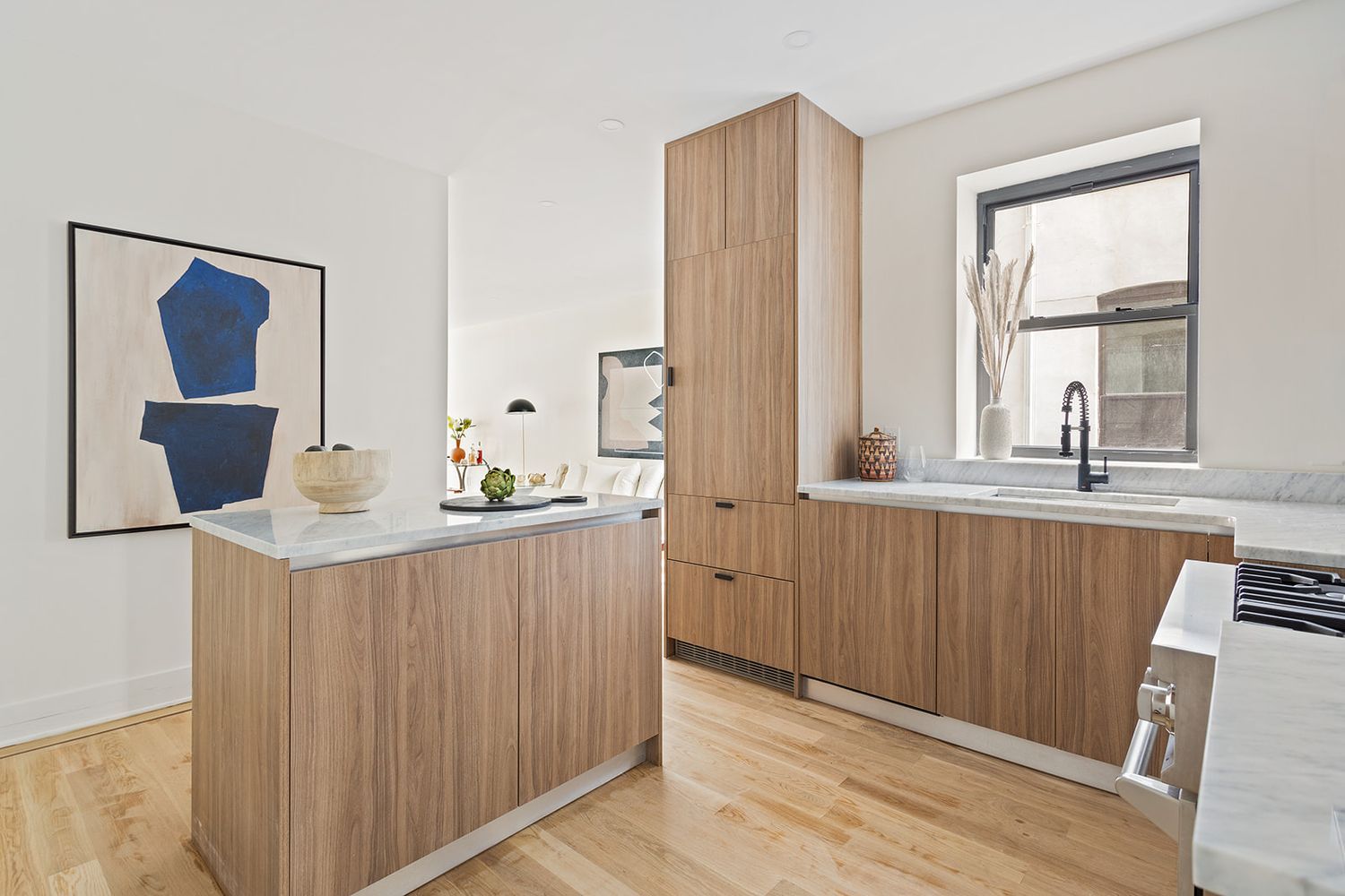 917 Saint Marks Avenue, Unit 3 Brooklyn, NY 11213 - Photo 6 of 12 a kitchen with a wooden floor and a window