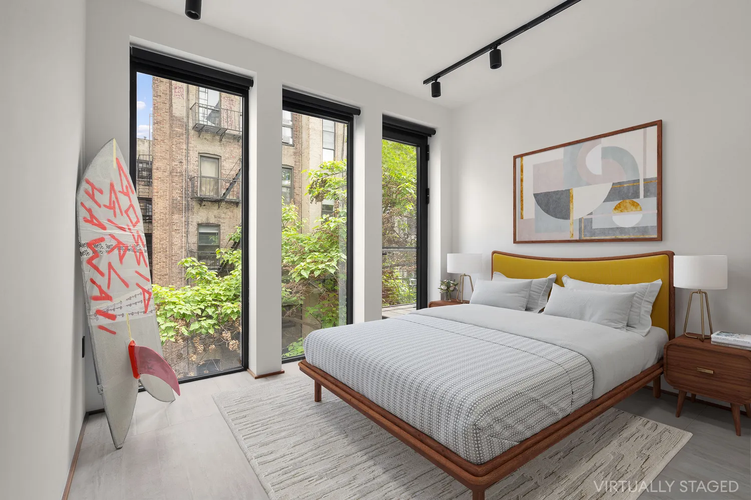 a bedroom with a bed and a painting on the wall