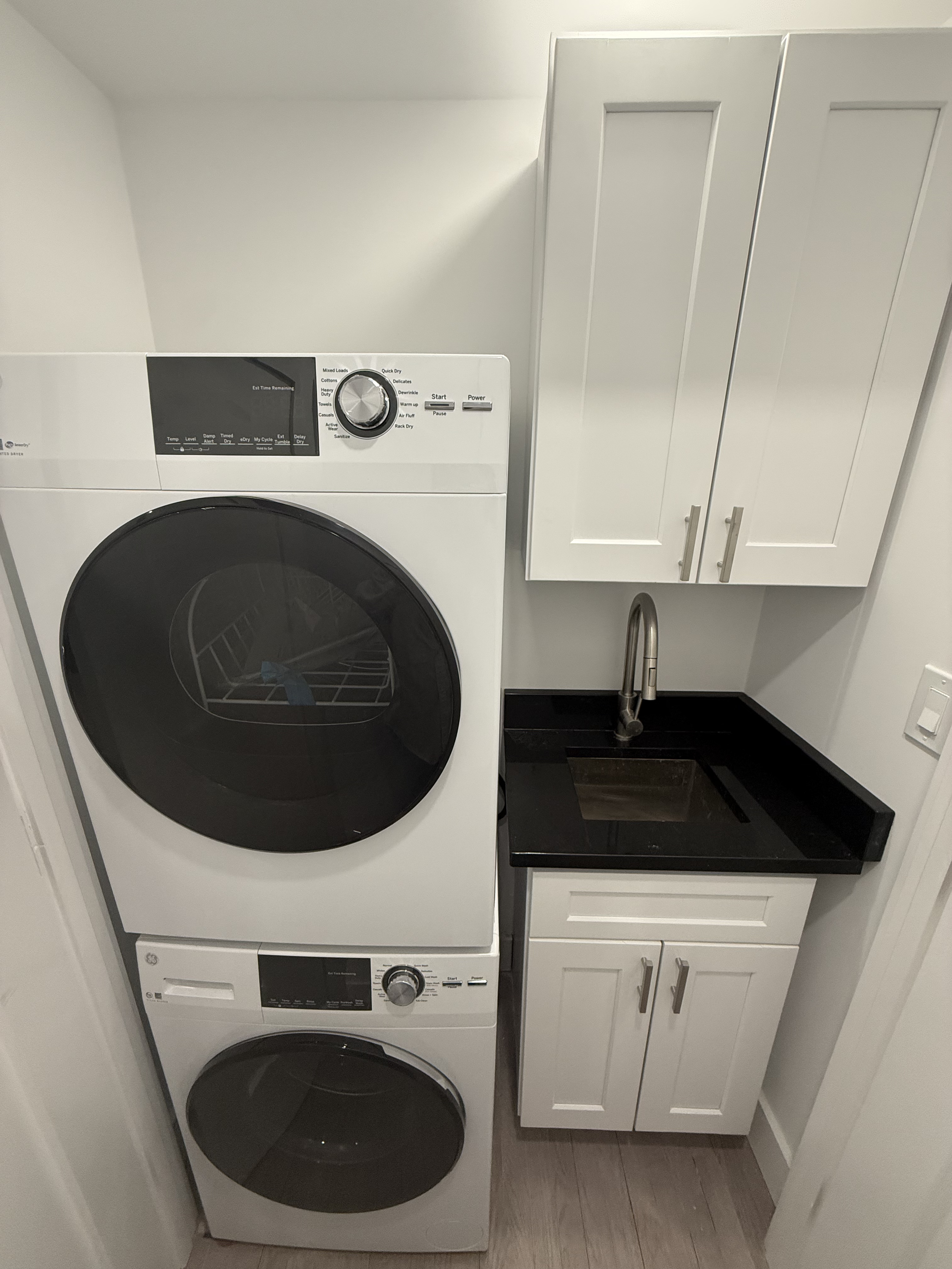 316 West 19th Street, Unit 4W Manhattan, NY 10011 - Photo 4 of 7 a close view of a sink and washer and dryer