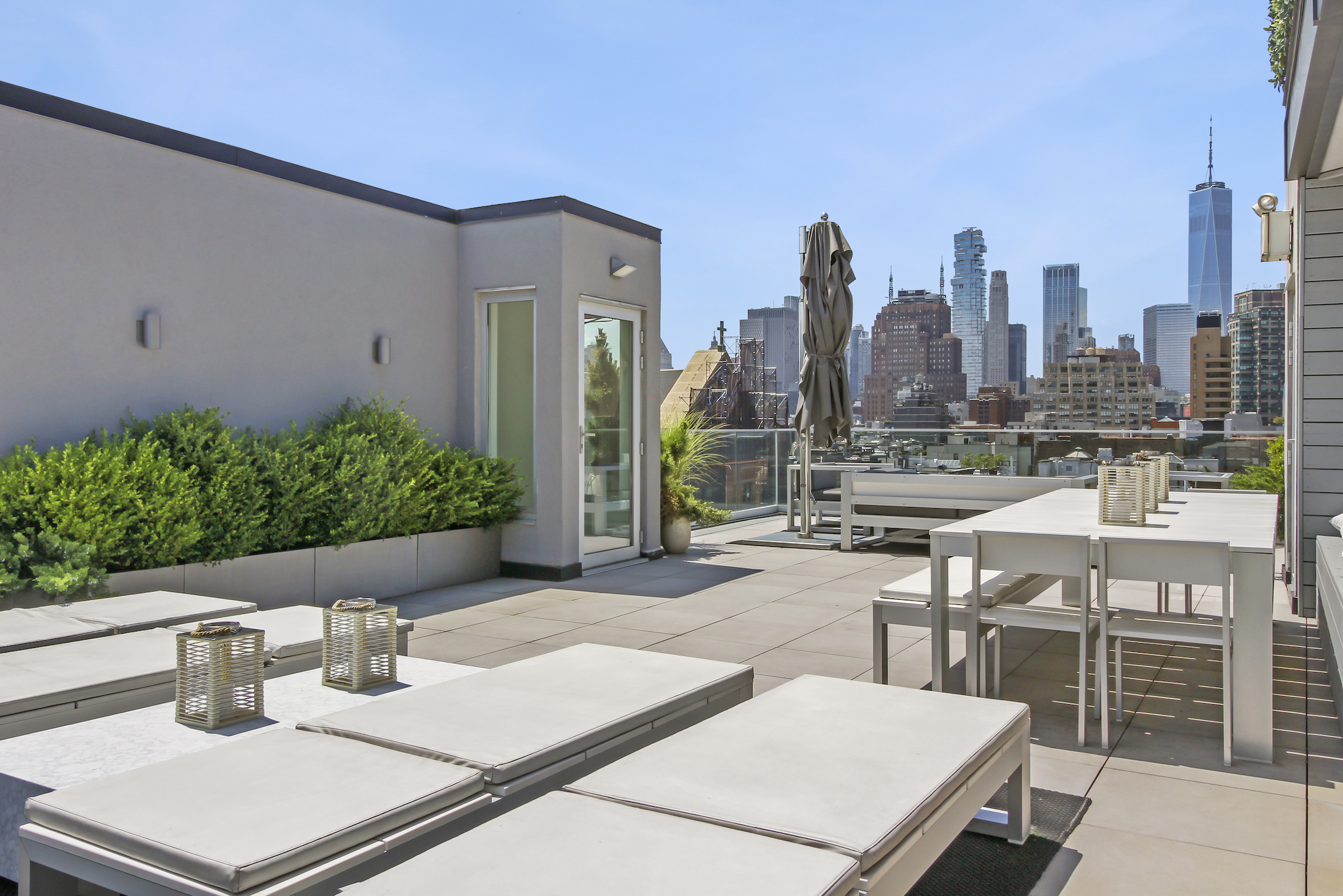 136 West Houston Street, Unit PH Manhattan, NY 10012 - Photo 5 of 26 a view of a patio with table and chairs and potted plants