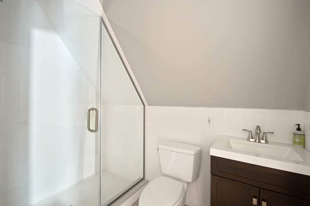 1617 Dorchester Road, Unit 3 Brooklyn, NY 11226 - Photo 6 of 6 a bathroom with a sink toilet and shower